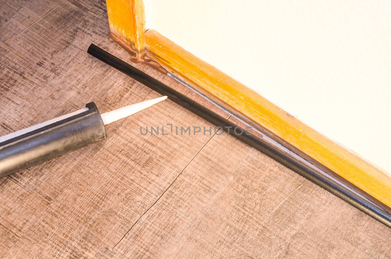 Application of caulking gun, applying glue, attachment page footer .