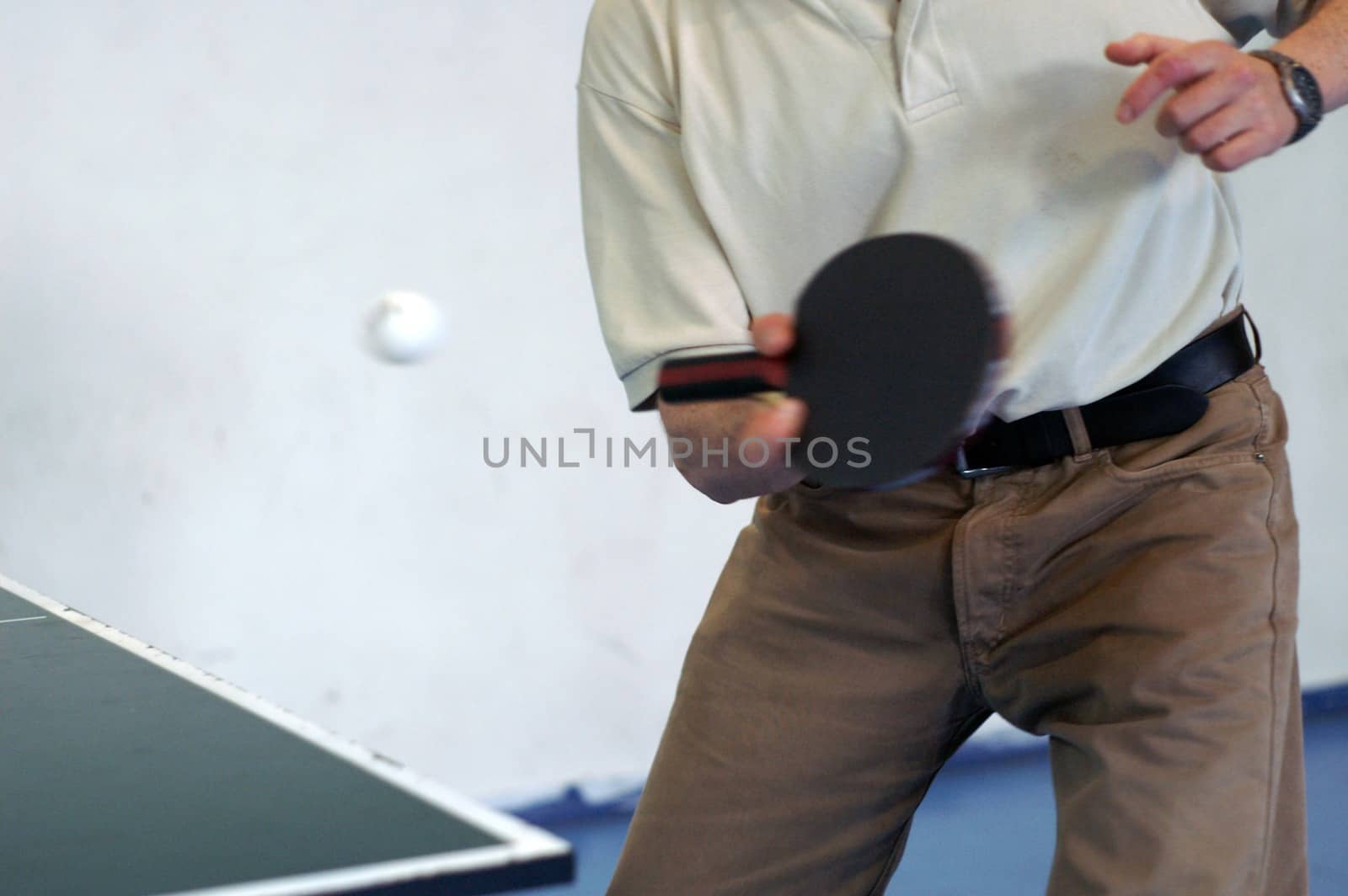 office man playing ping pong at a break time