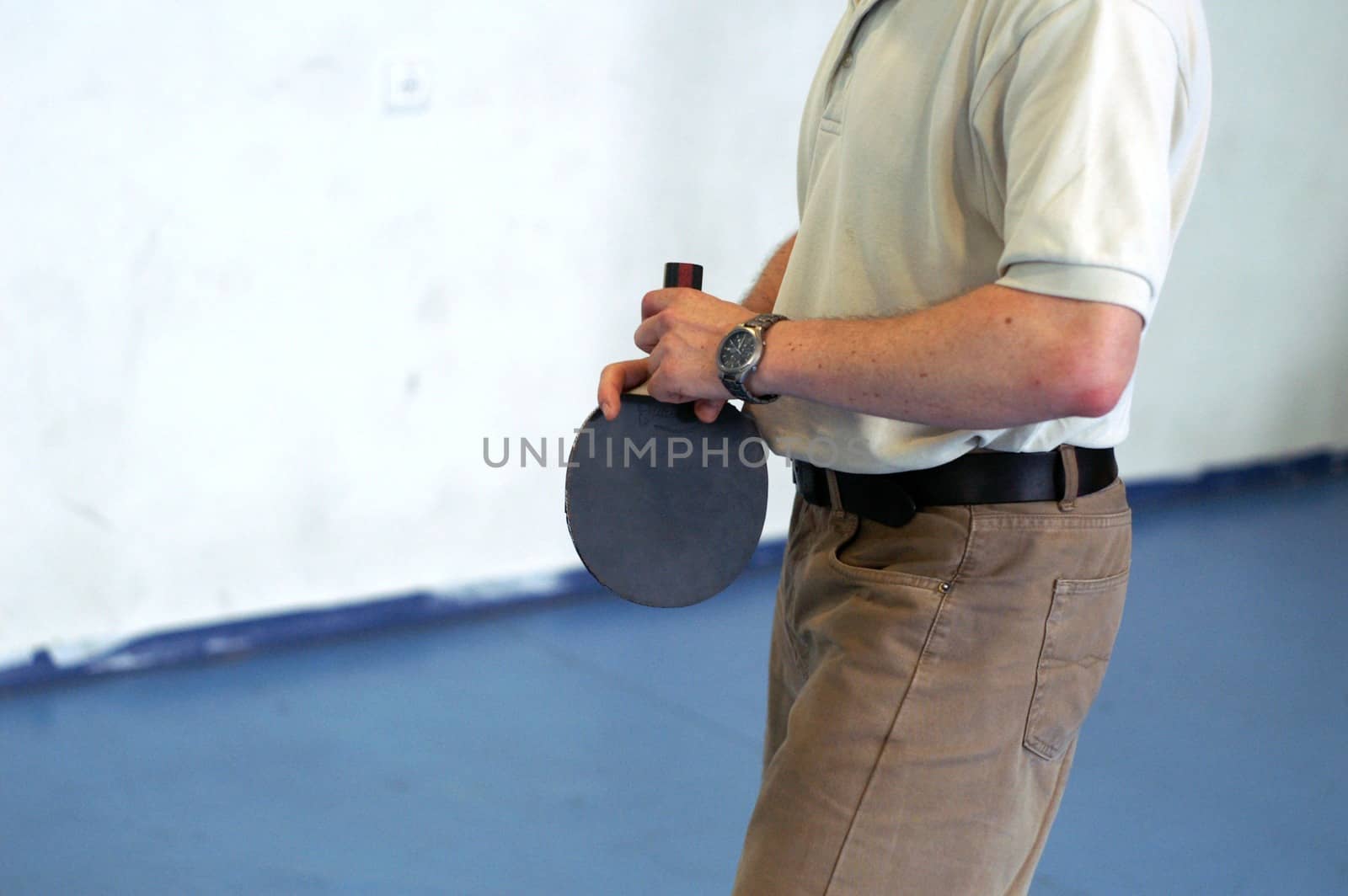 office man playing ping pong at a break time