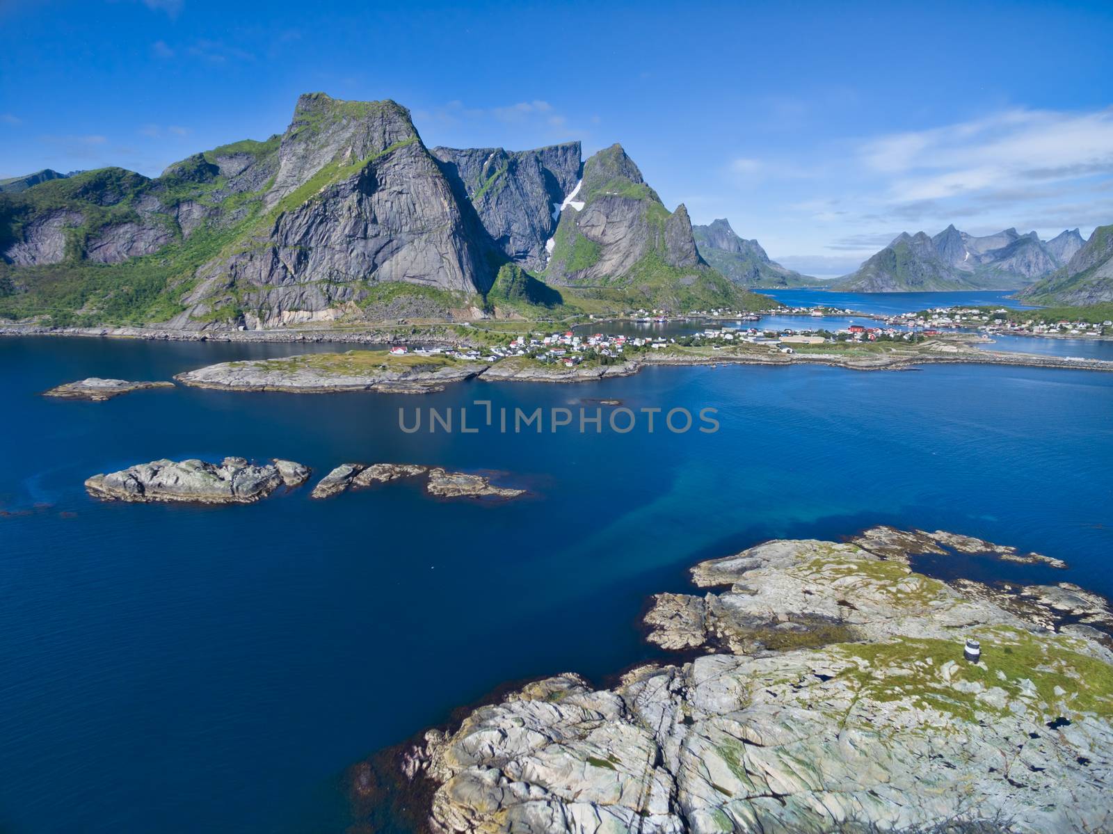 Scenic aerial view of Reine and surrounding fjords and peaks on Lofoten islands in Norway