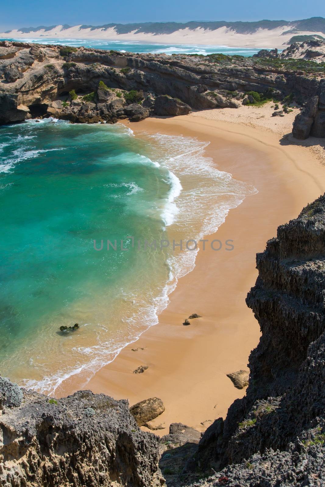 Beautiful secluded beach with rock formations at the coast at Kenton on Sea in South Africa