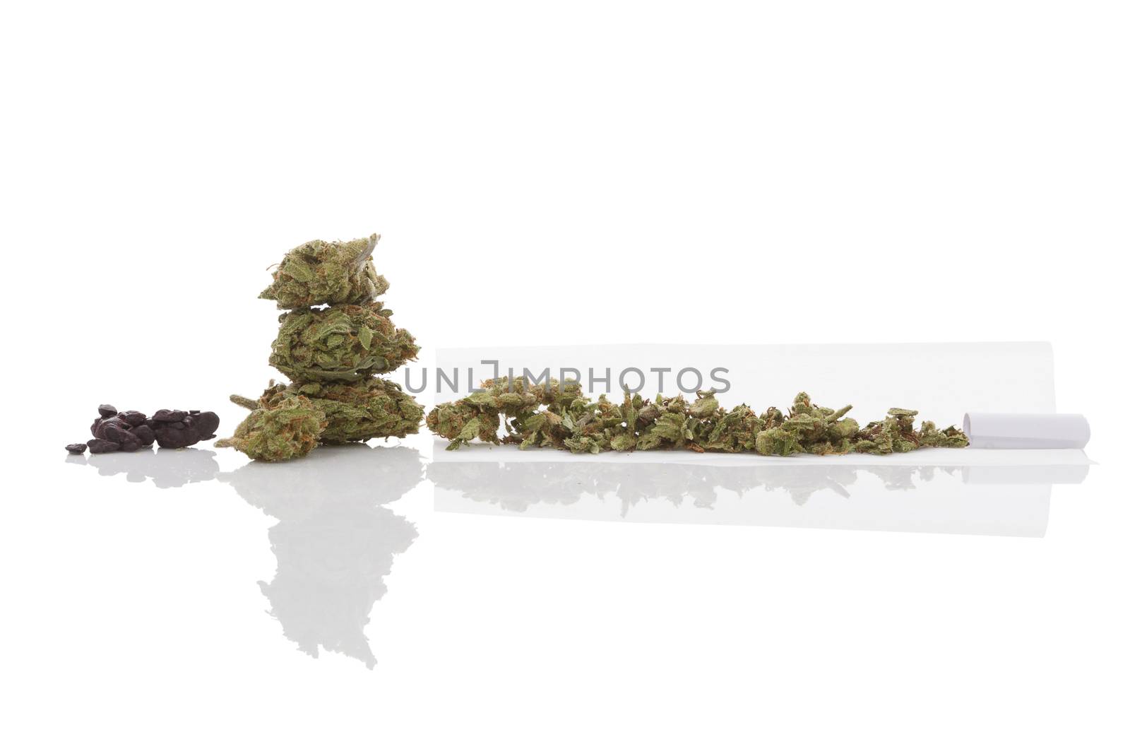 Smoking marijuana. Cannabis abuse. Marijuana bud, hashish and rolled joint isolated on white background. 