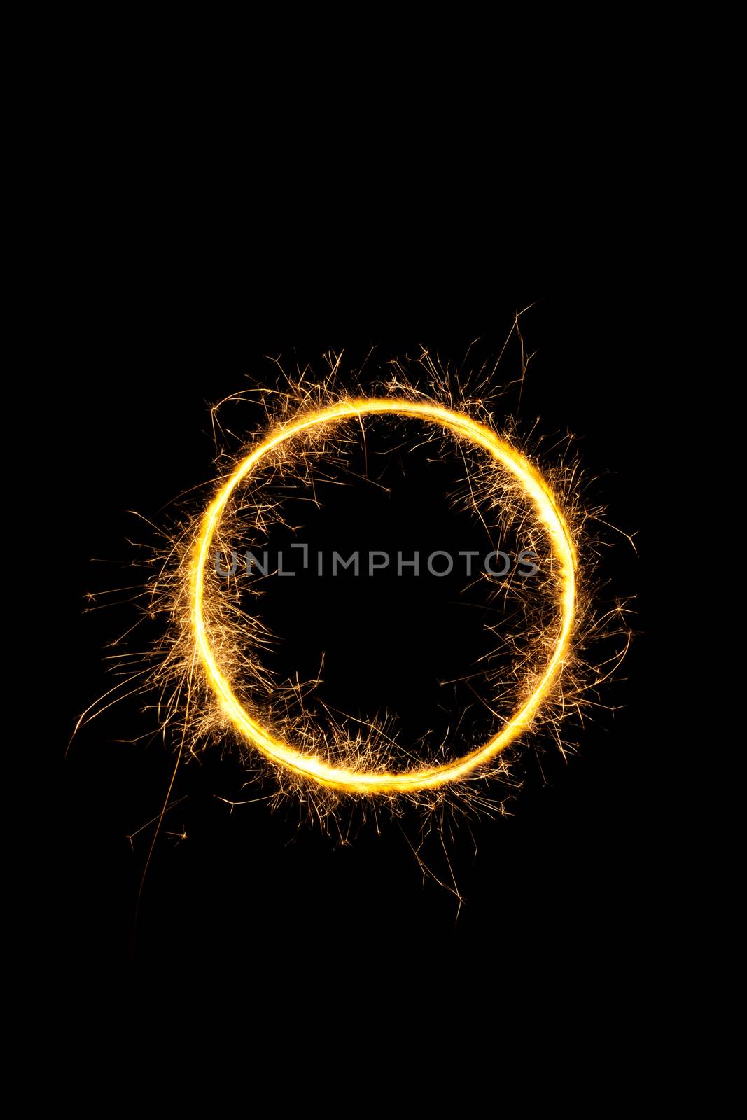 Sparkling light circle isolated on black background. 
