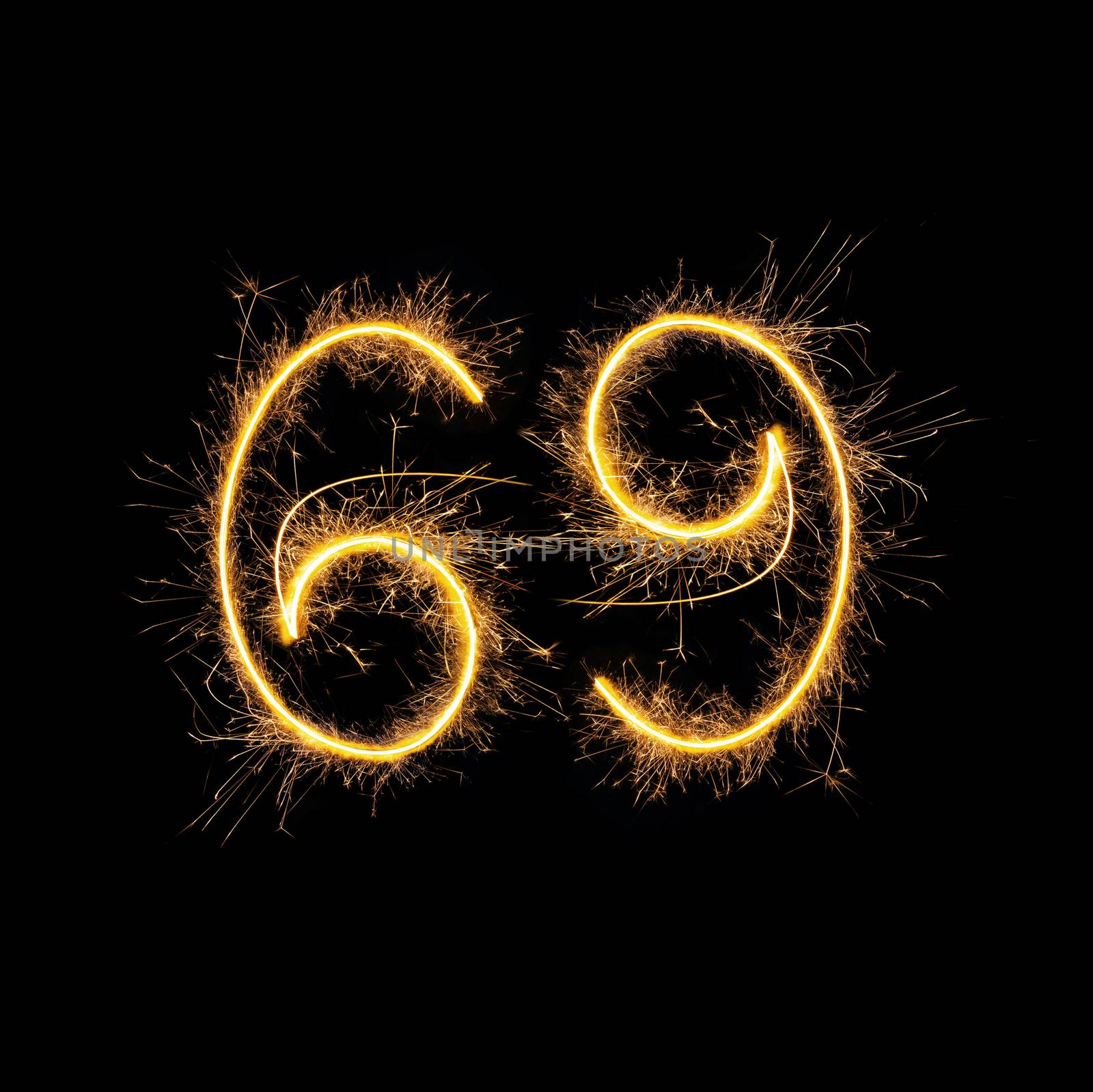 Number 69 in sparkling digits isolated on black background. Symbol of sexual position 69.