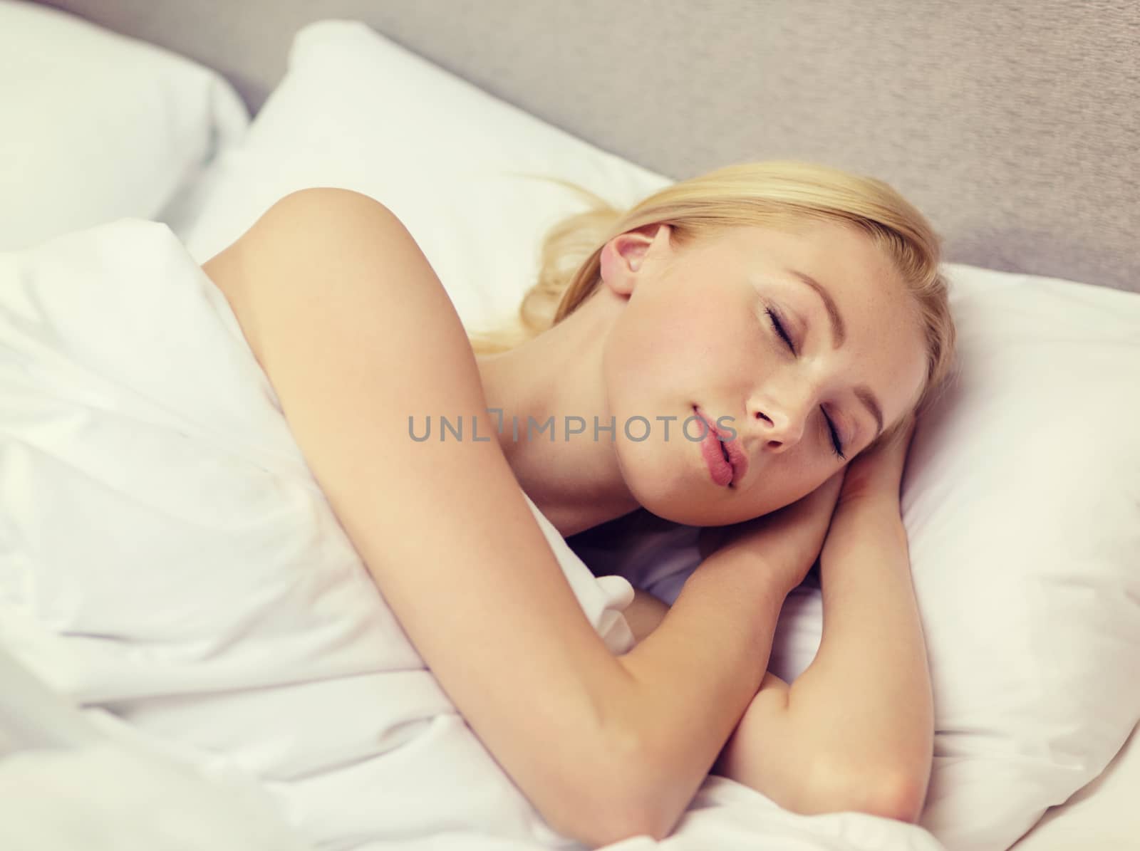 beautiful woman sleeping in bed by dolgachov
