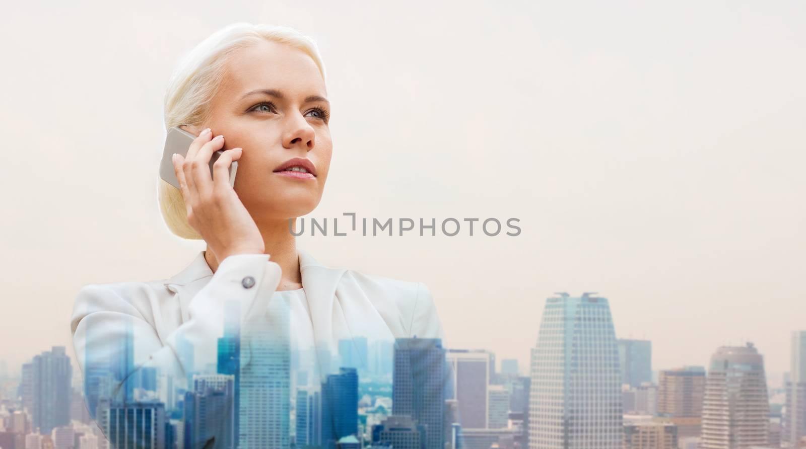 serious businesswoman with smartphone in city by dolgachov