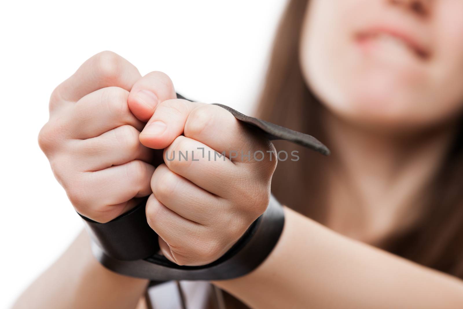 BDSM sexual fetish and games concept - beauty adult passionate woman with leather belt or strap tied hands white isolated