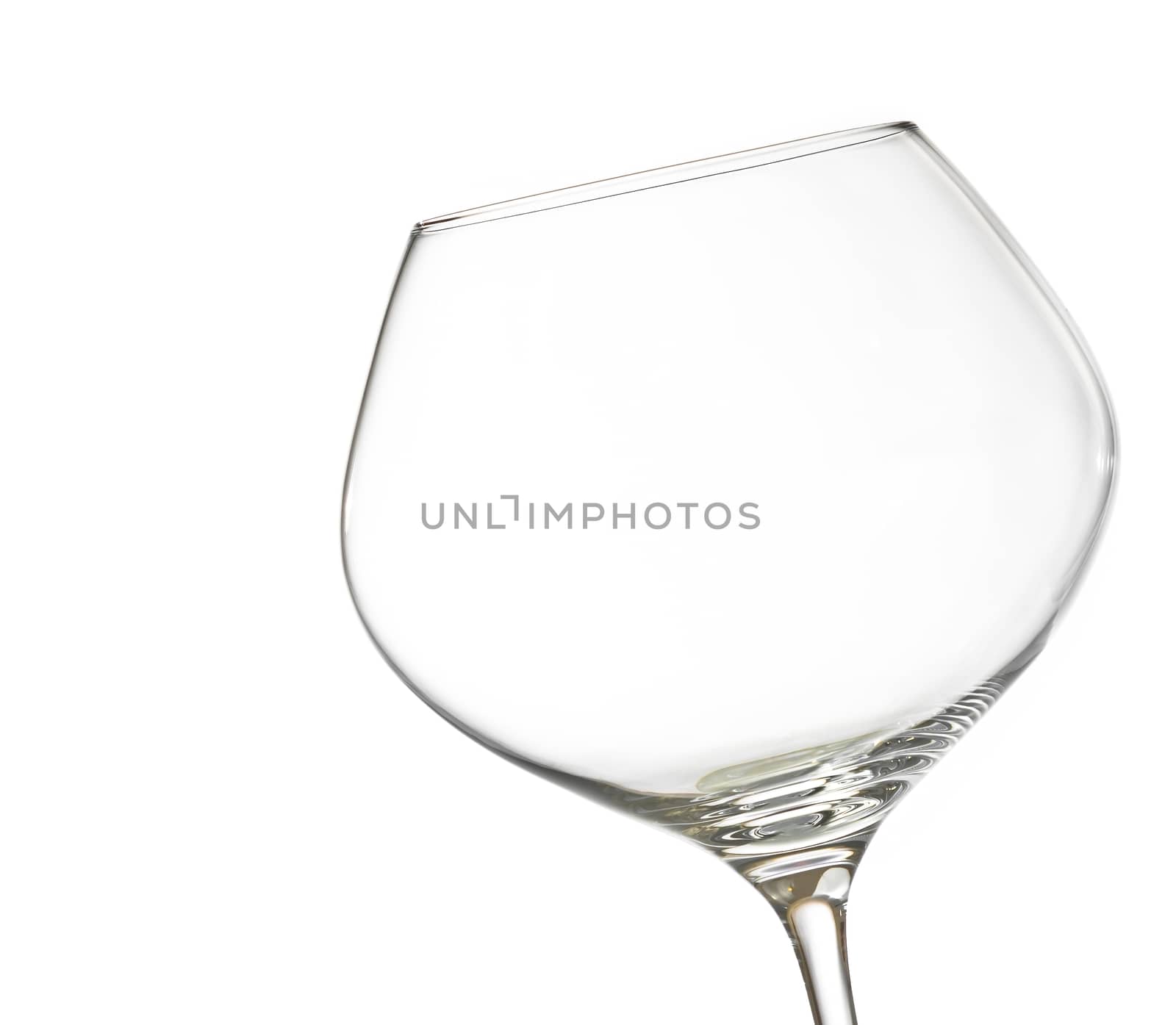 empty white wine into a glass on white background with space for text