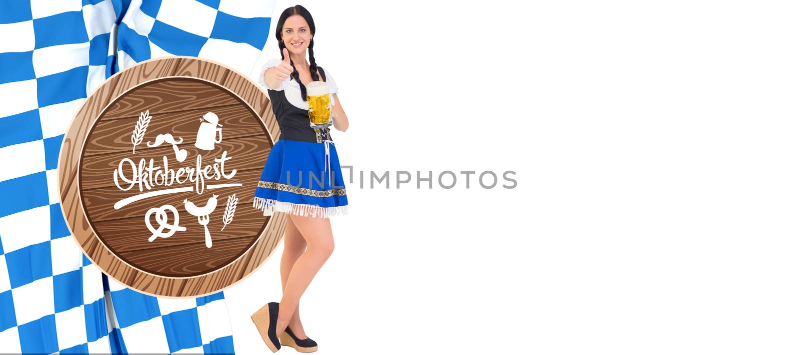 Pretty oktoberfest girl holding beer tankard against oktoberfest graphics