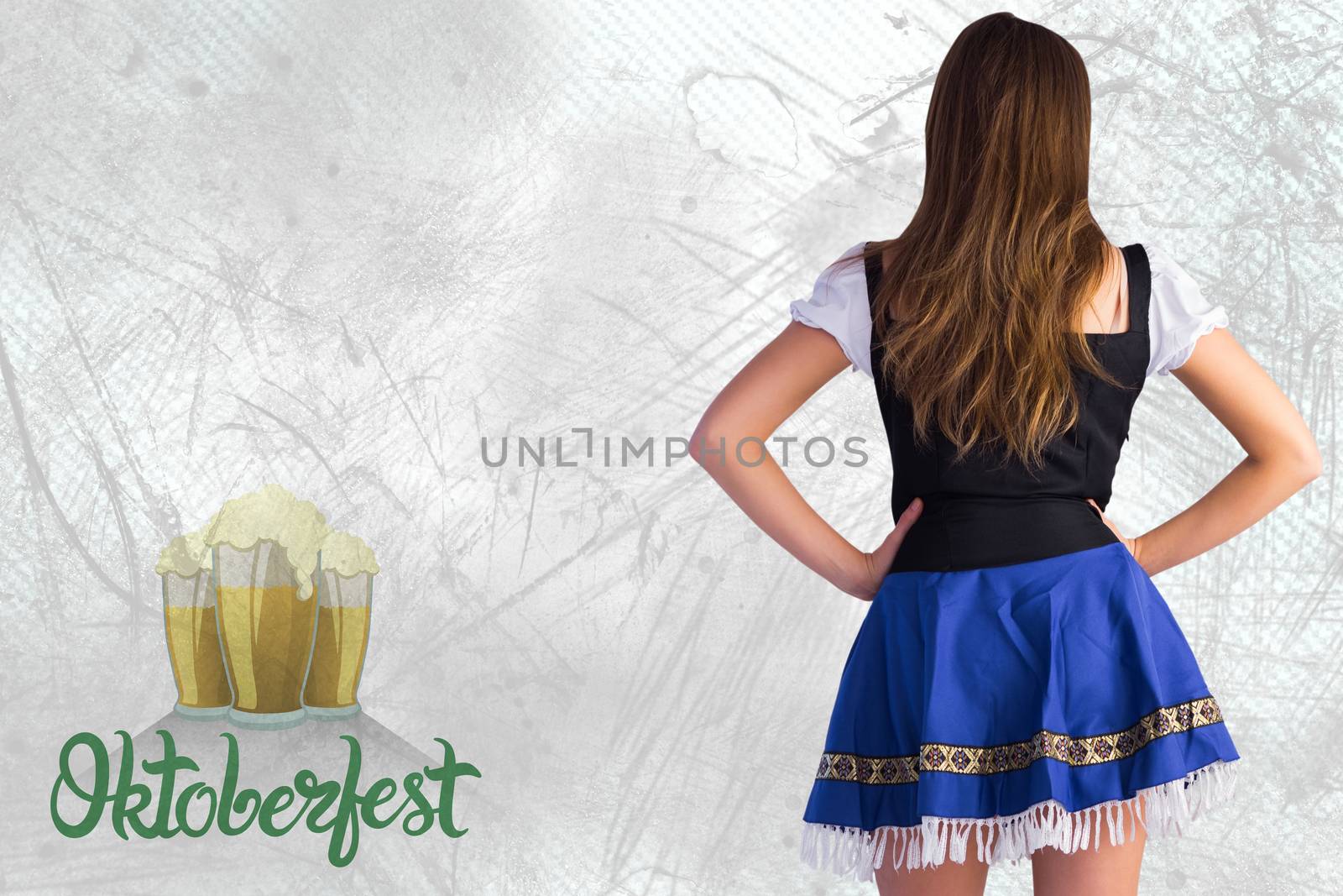 Oktoberfest girl standing with hands on hips against oktoberfest graphics