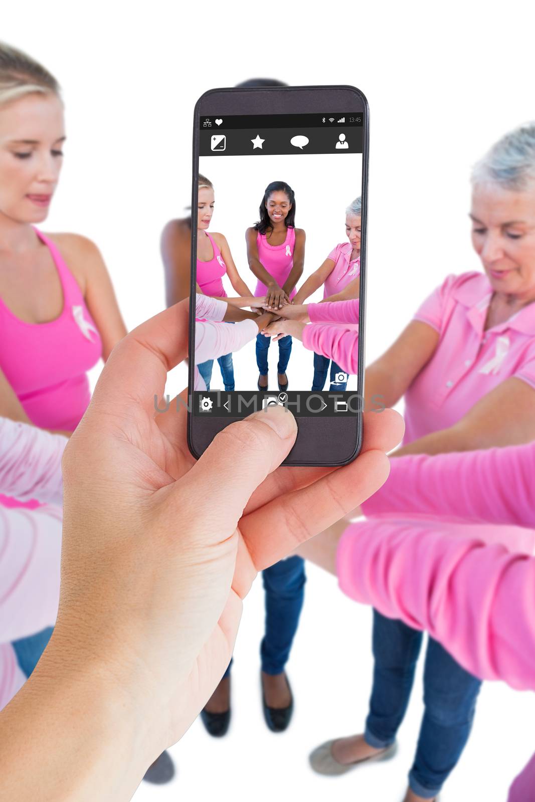 Female hand holding a smartphone against camera