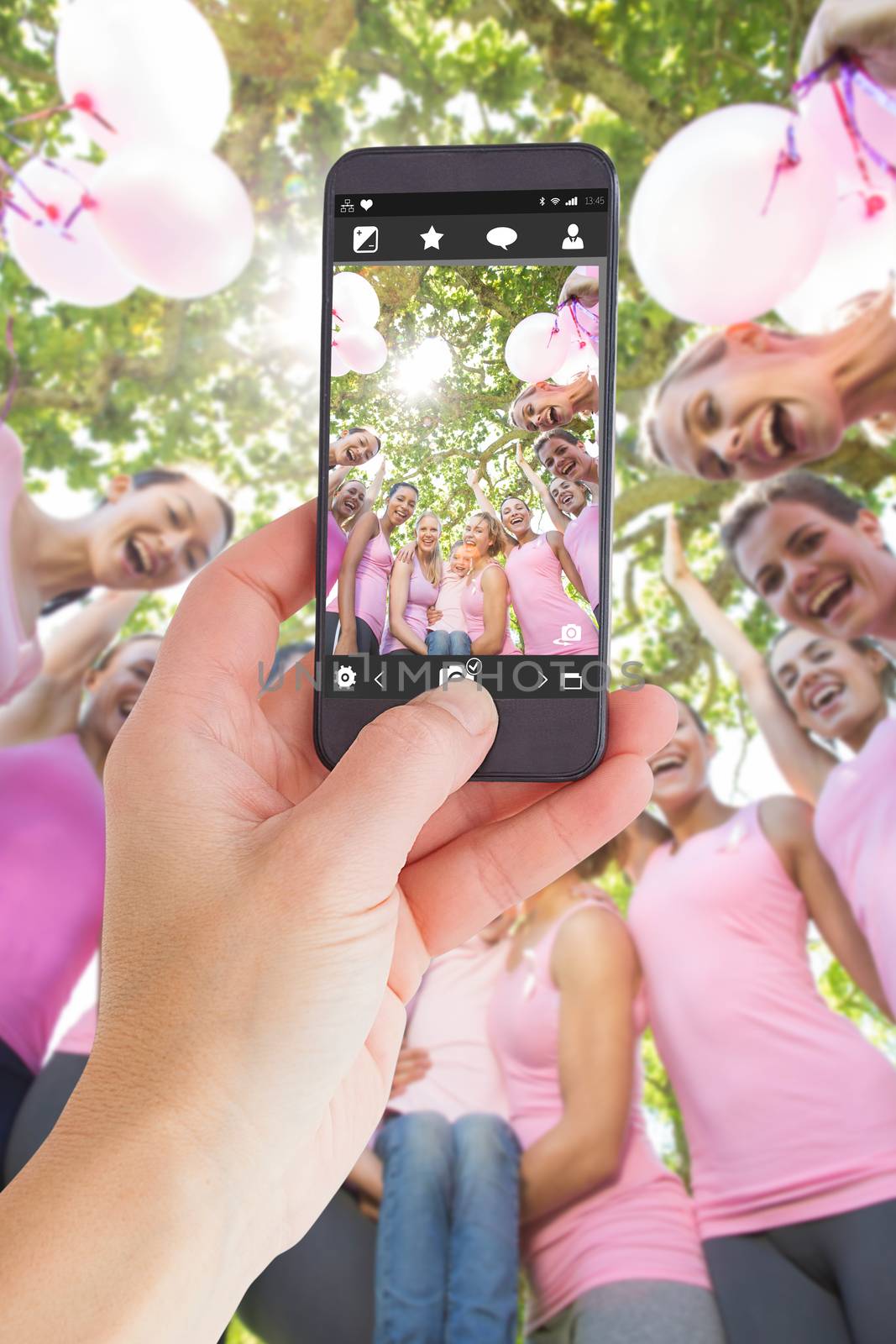 Composite image of female hand holding a smartphone by Wavebreakmedia