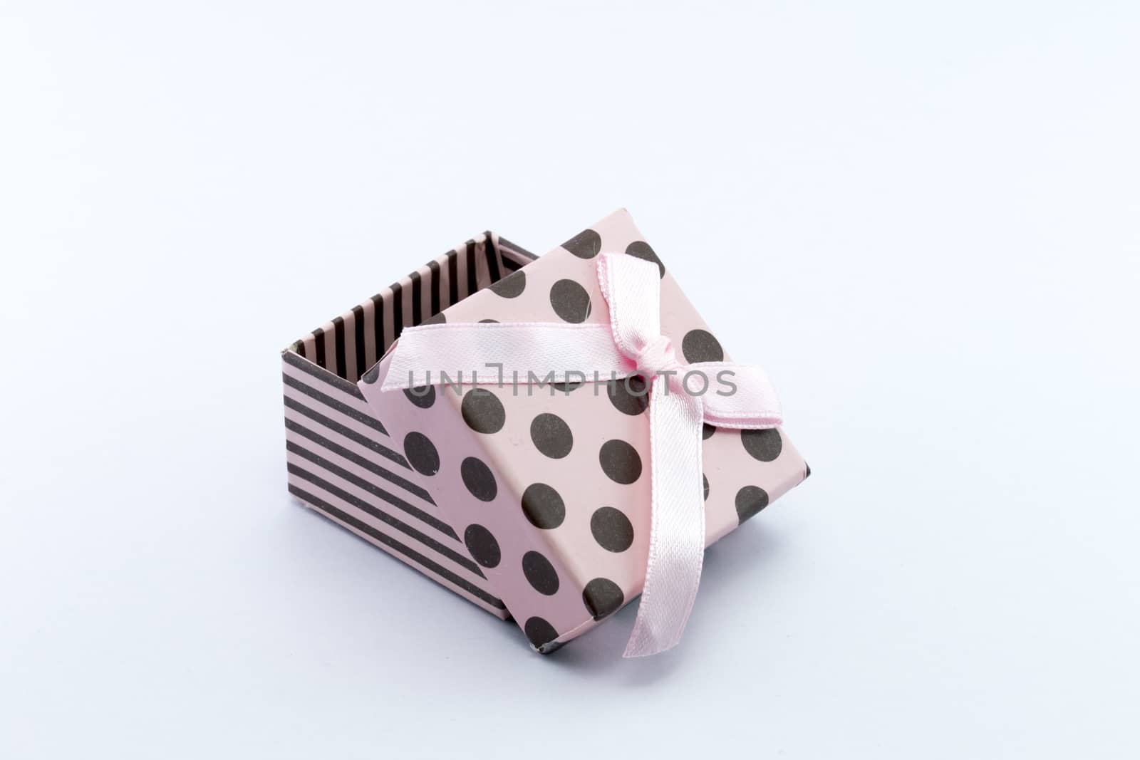 Pink gift box is opened isolated on white background. by teerawit