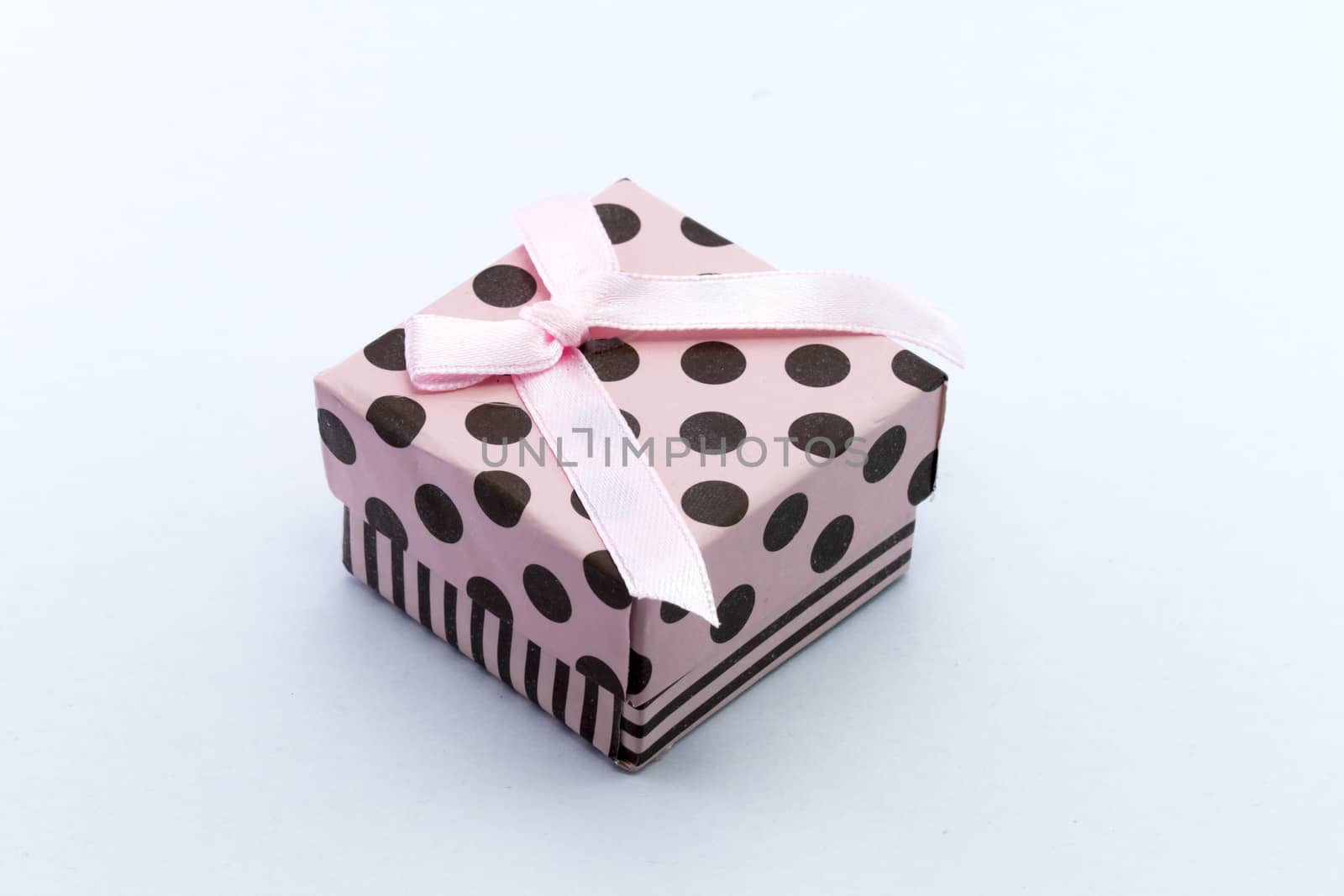 Pink gift box isolated on white background. by teerawit