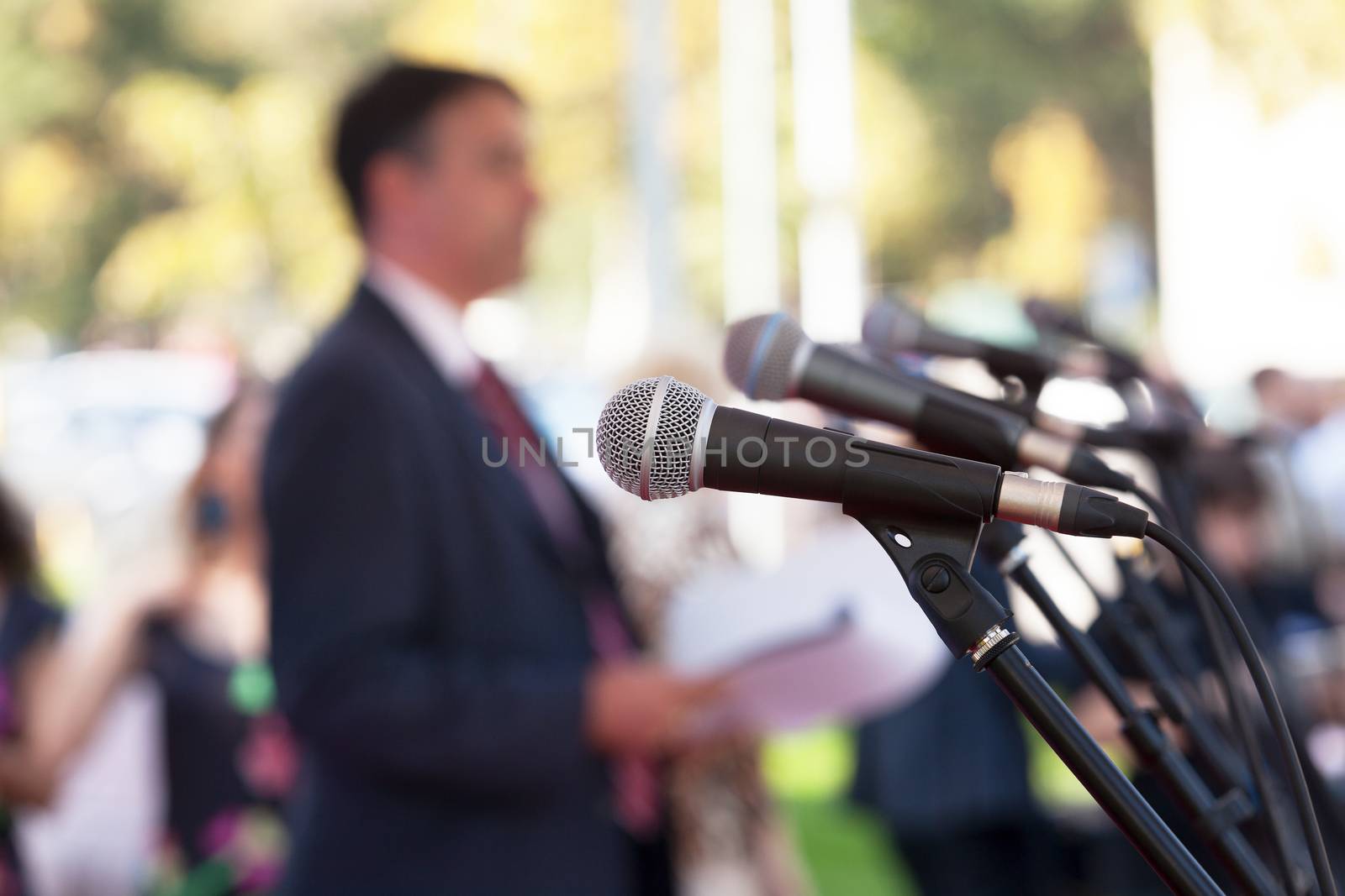 News conference. Microphones. by wellphoto