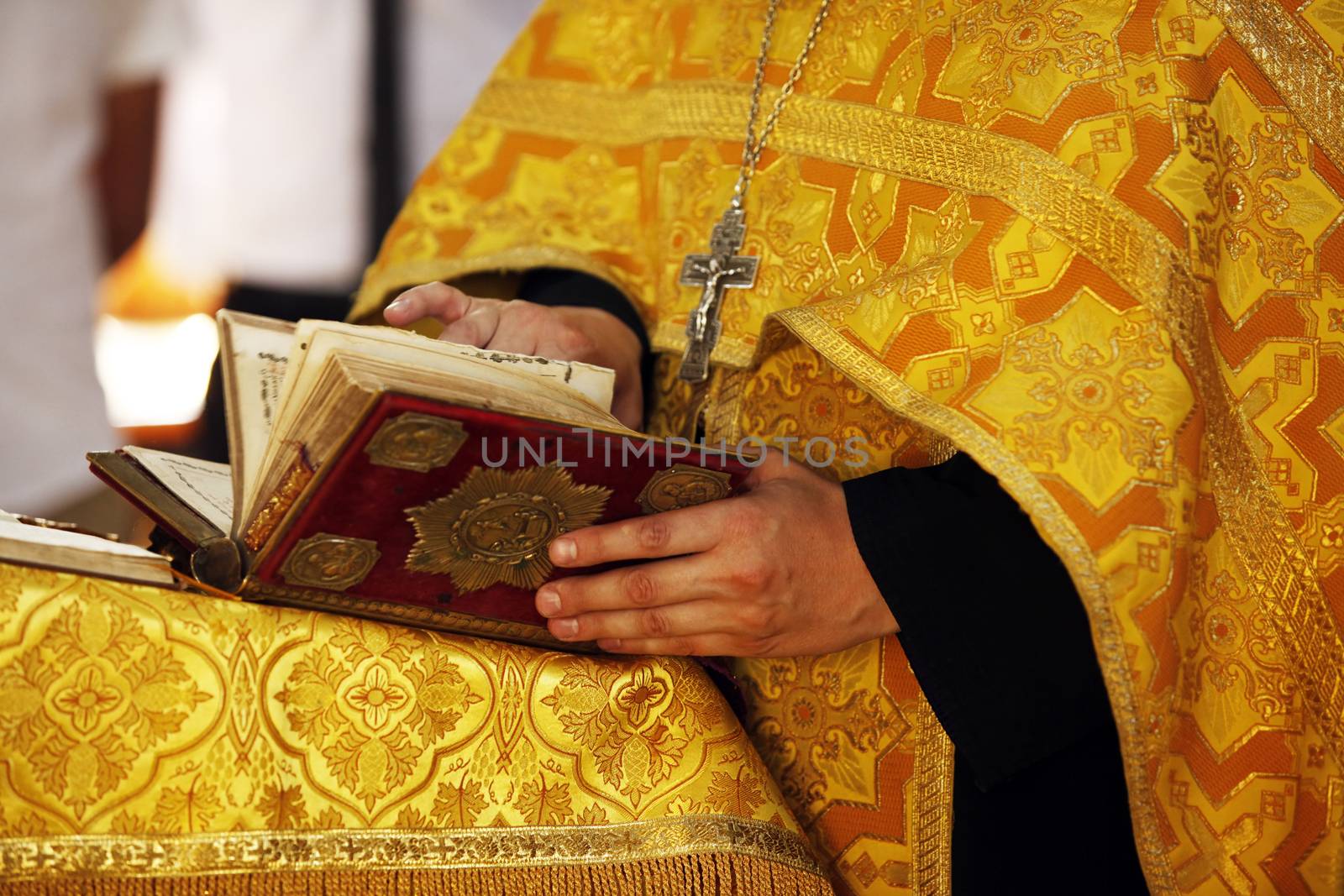 The Bible in hands of the priest