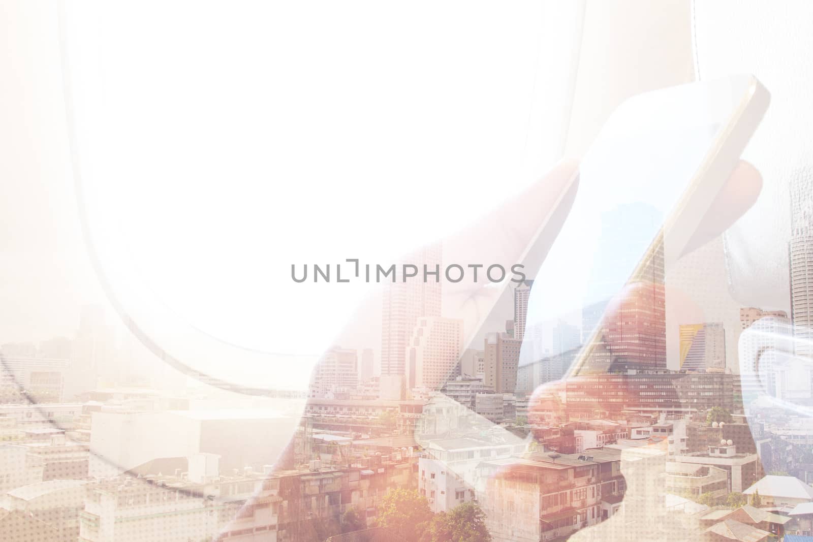 Double exposure image of business man sits in airplane using his cell phone and cityscape background, Business technology concept.