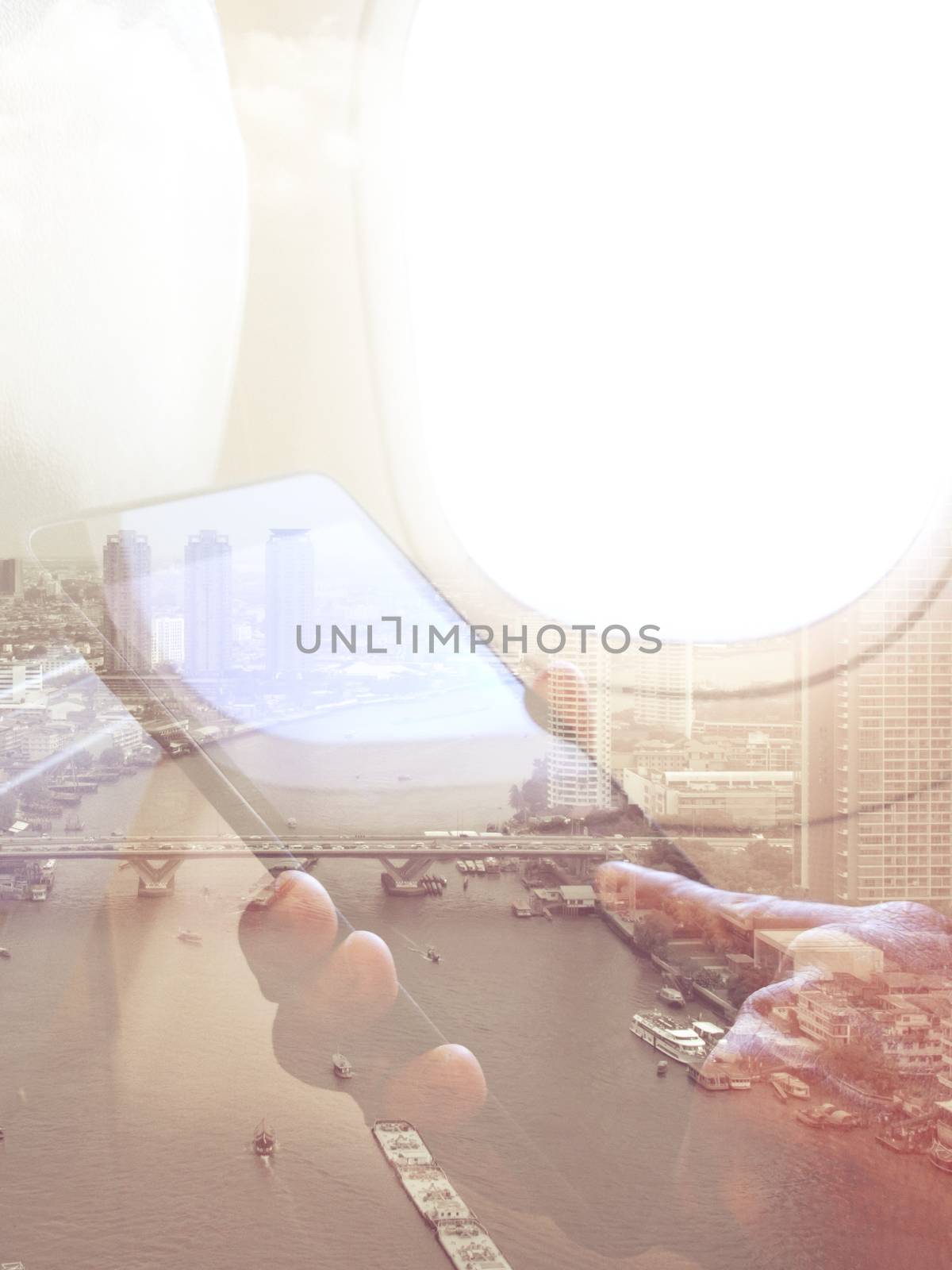 Double exposure image of business man sits in airplane using his tablet and cityscape background, Business technology concept.
