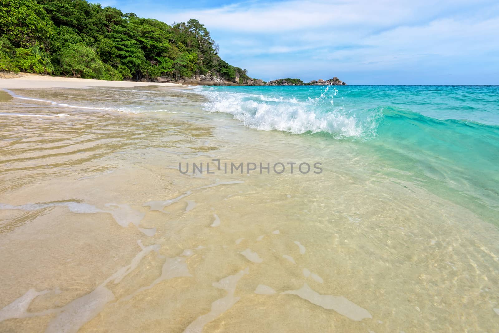 Beautiful landscape blue sea white sand and waves on the beach during summer at Koh Miang island in Mu Ko Similan National Park, Phang Nga province, Thailand