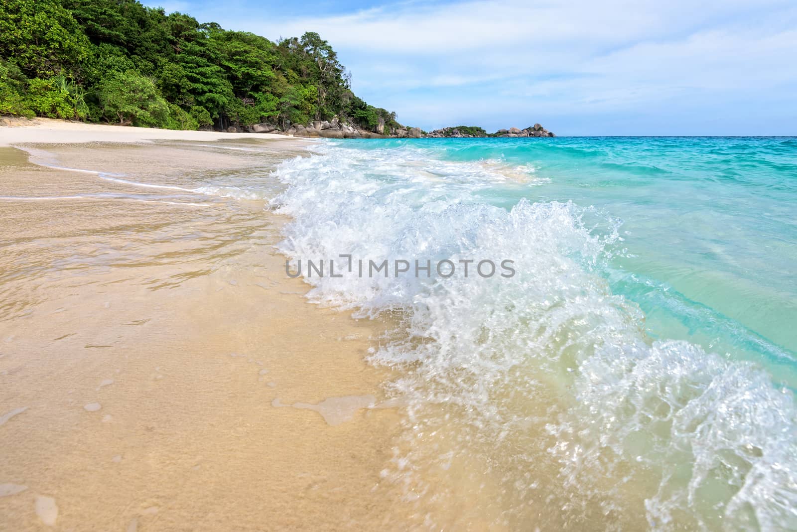 Beautiful landscape blue sea white sand and waves on the beach during summer at Koh Miang island in Mu Ko Similan National Park, Phang Nga province, Thailand