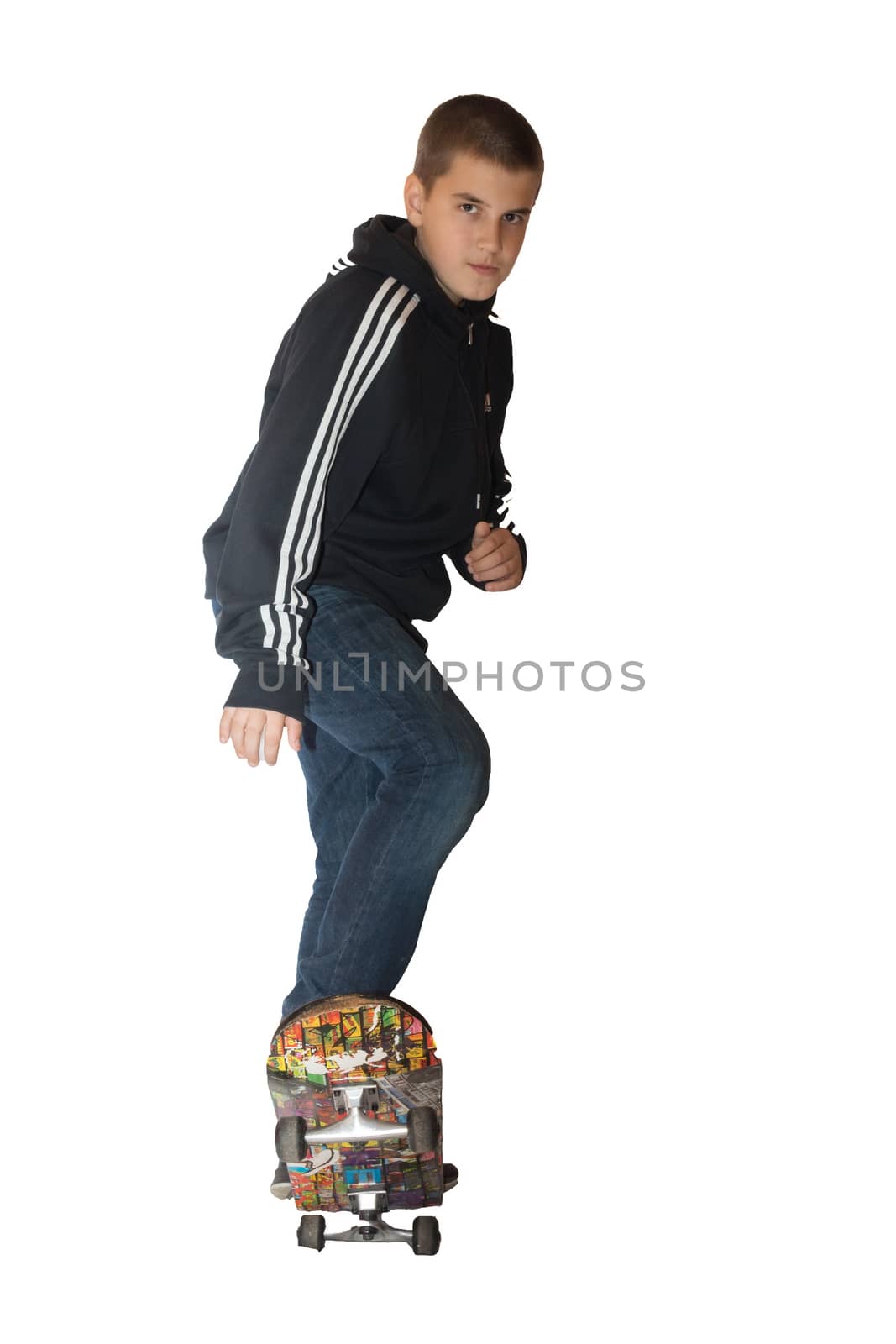 the photograph depicts a boy on a skateboard