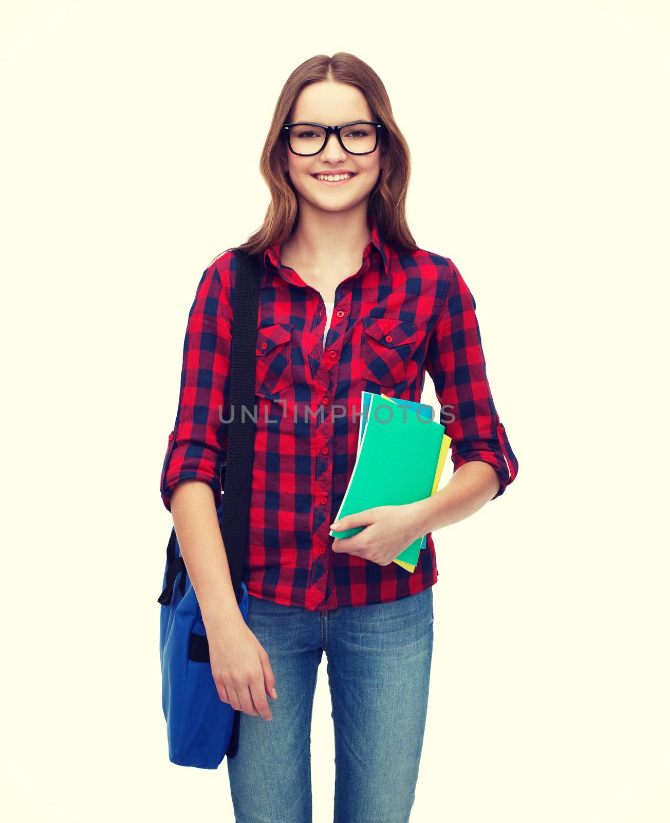 education and people concept - smiling female student in eyeglasses with laptop bag and notebooks