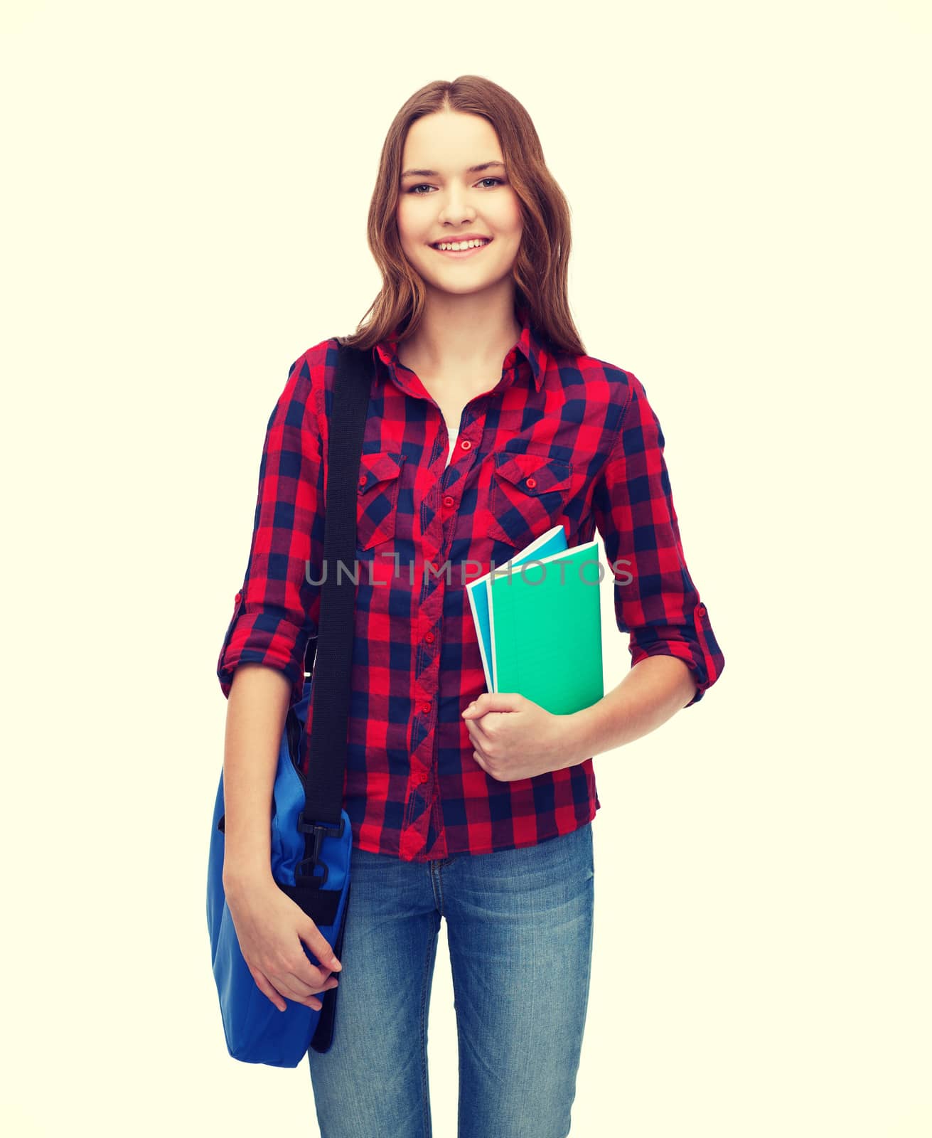 smiling female student with bag and notebooks by dolgachov