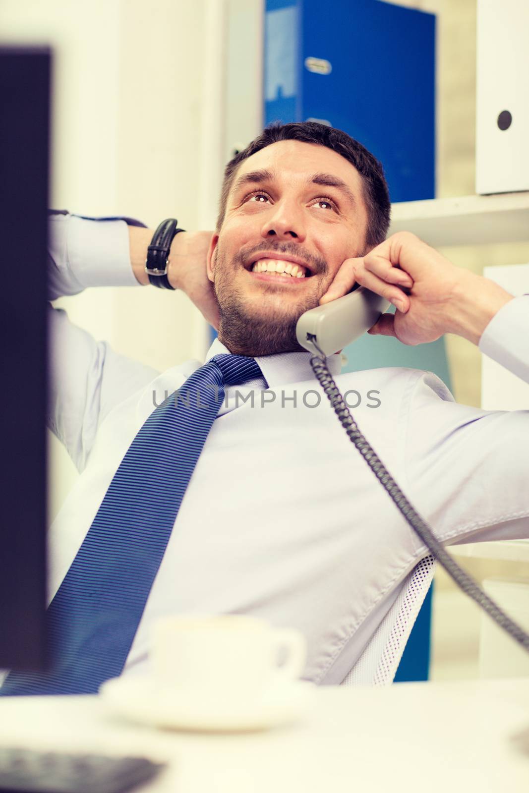 office, business, education, technology and internet concept - smiling businessman or student with computer and phone