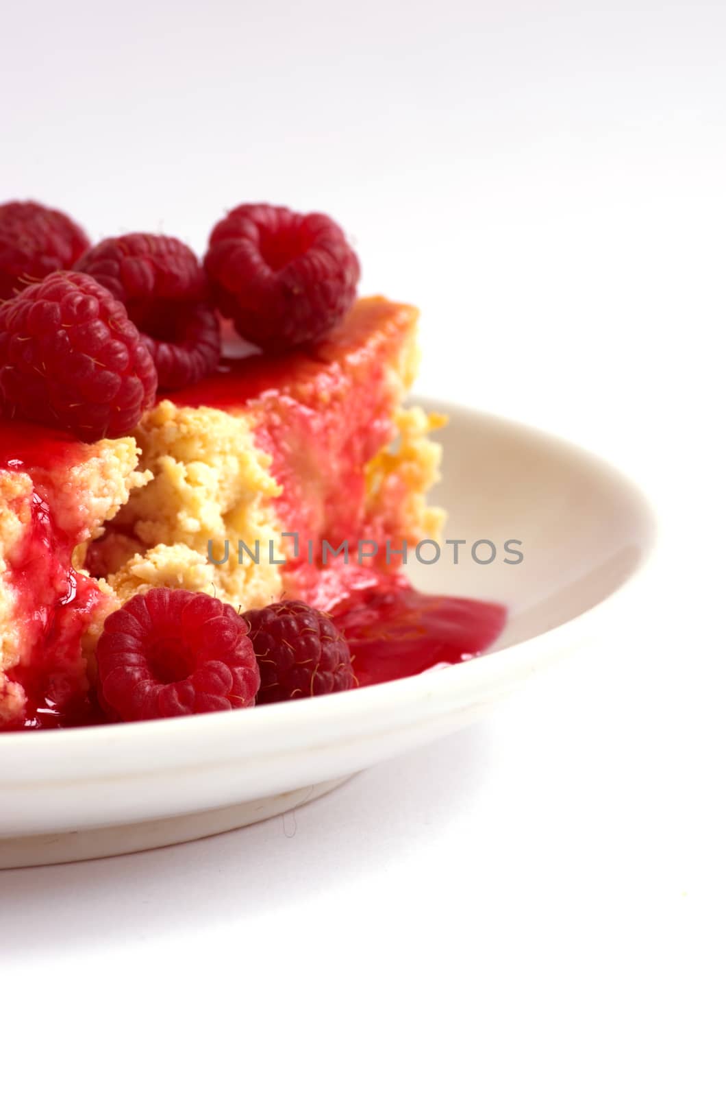 cake with raspberries and cream cheese decorated with fresh raspberries and mint. the toning. selective focus