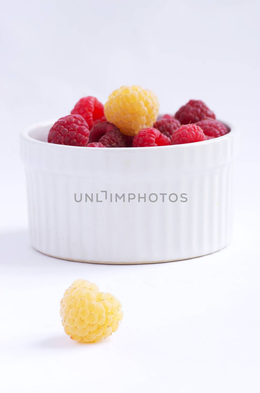 A beautiful selection of freshly picked ripe red raspberries by dolnikow