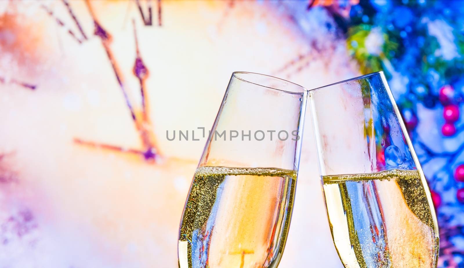 New Year or Christmas at midnight with champagne flutes make cheers on clock background by donfiore