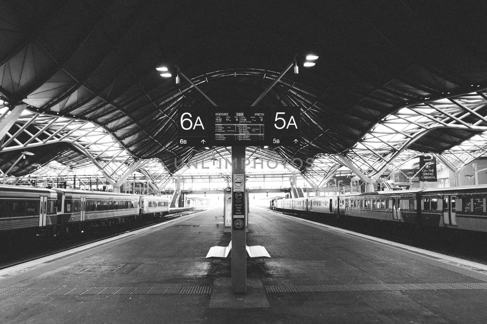 Regional Trains waiting for departure in a deserted station. Grain intentional.