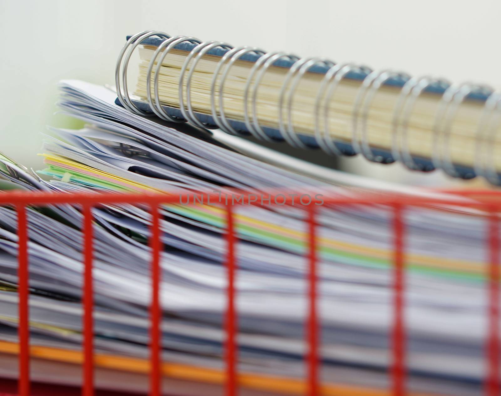 Basket for a documents and file placed on the desk in the room.                               