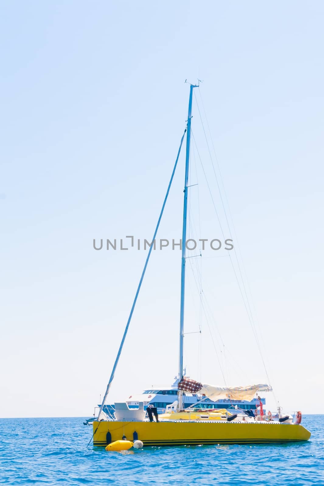 yellow sailboat sailing sail blue Mediterranean sea ocean horizon by donfiore