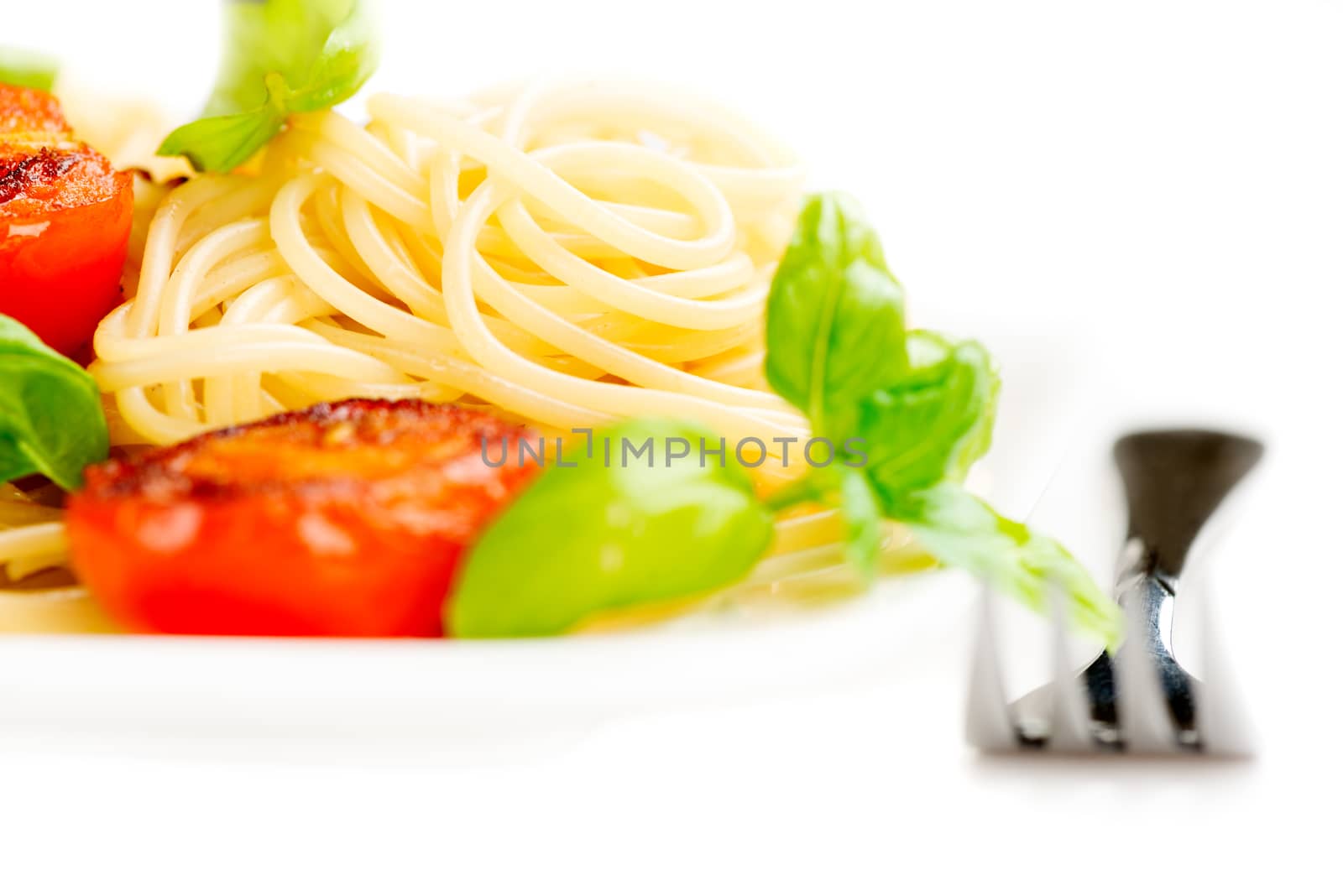 Traditional italian macaroni pasta with grilled tomato and orega by Nanisimova