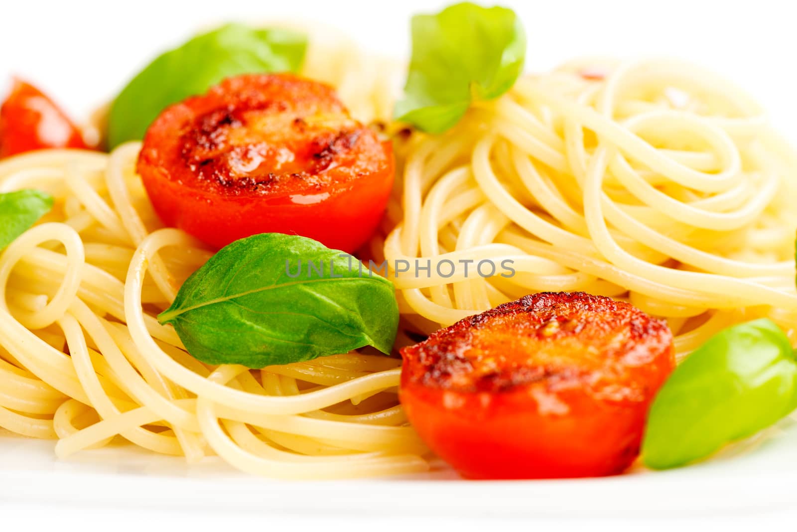 Traditional italian macaroni pasta with grilled tomato and oregano