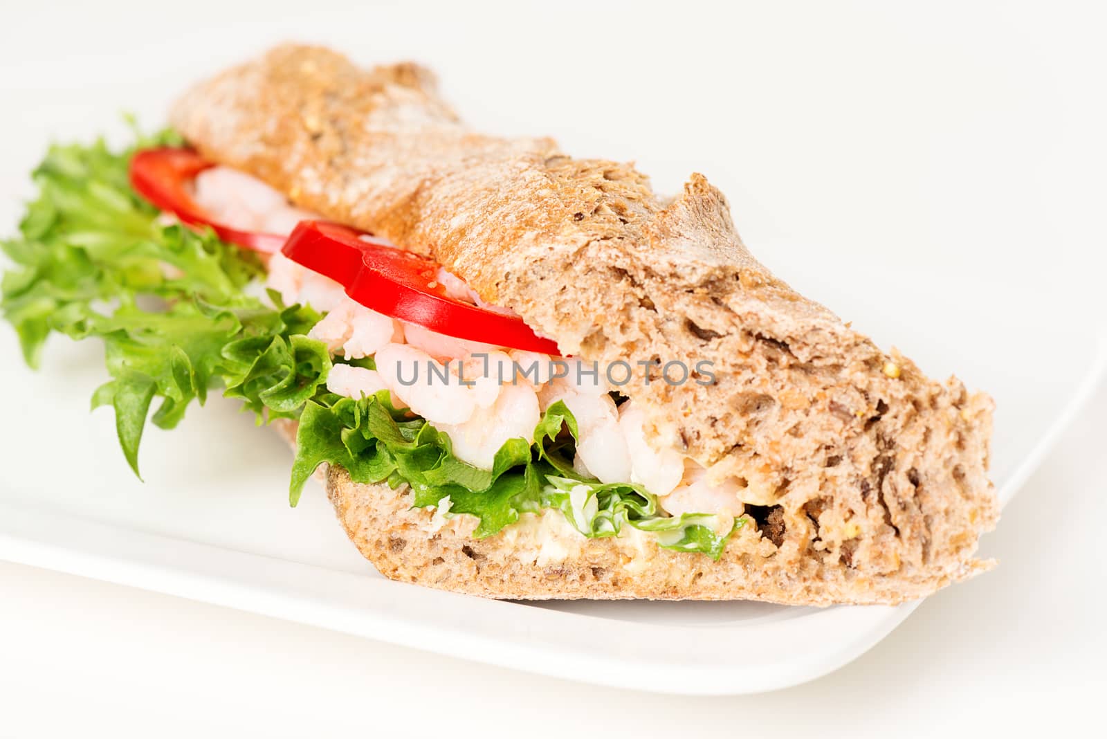 Prawn sandwich on white plate closeup by Nanisimova