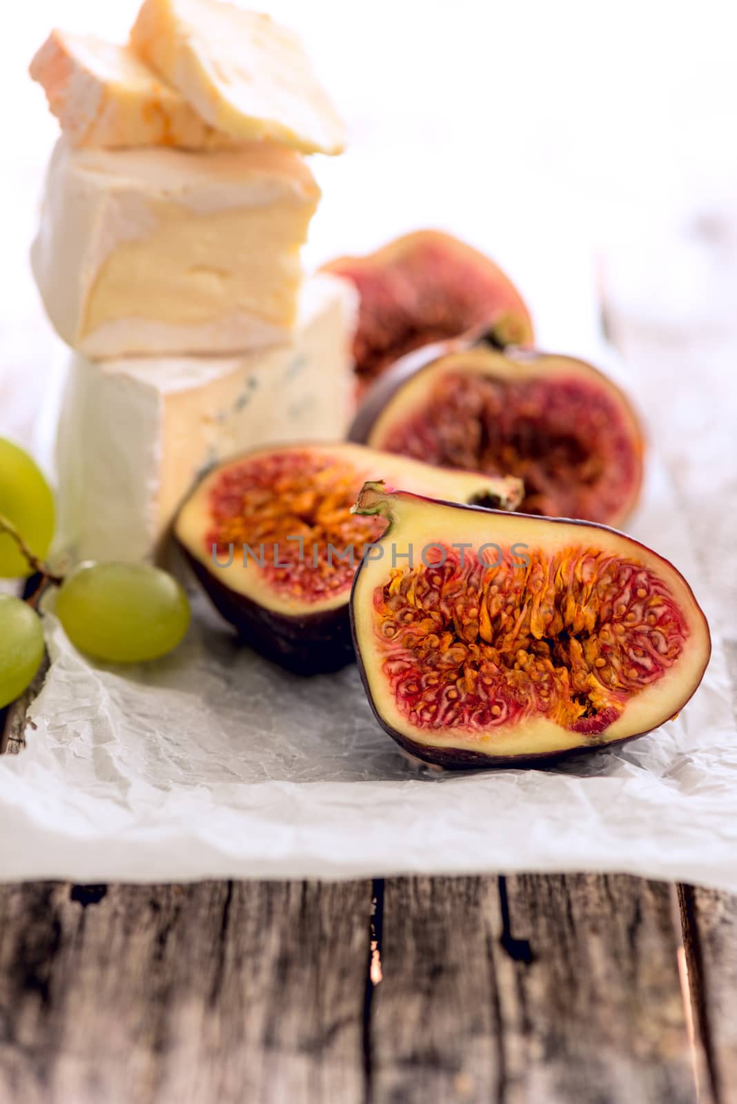 Cheese figs grapes by Nanisimova