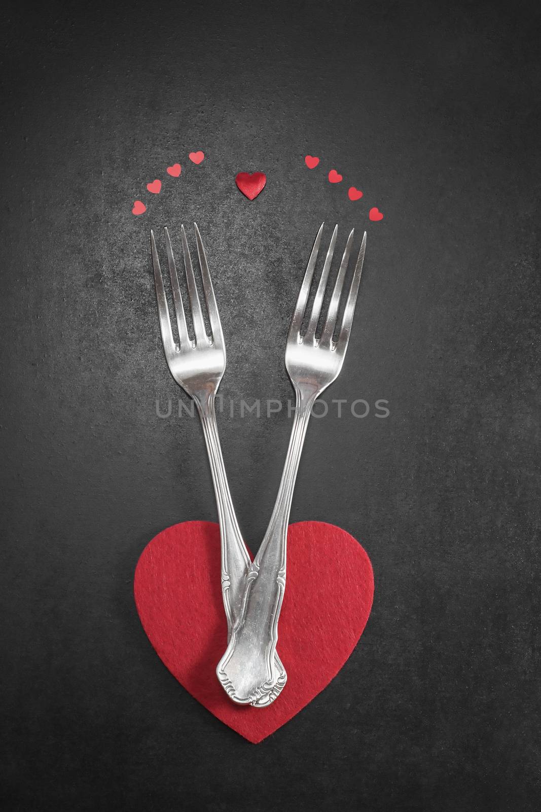 Valentines dinner table setting in rustic style with cutlery Romantic dinner concept. Done with a vintage retro filter