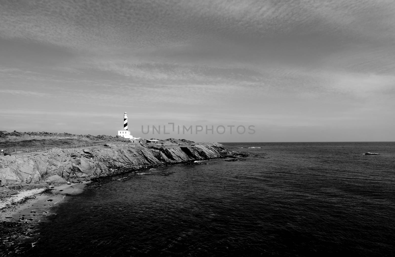 Lighthouse on Mediterranean Shore of Menorca, Balearic Islands. Monochrome Toned