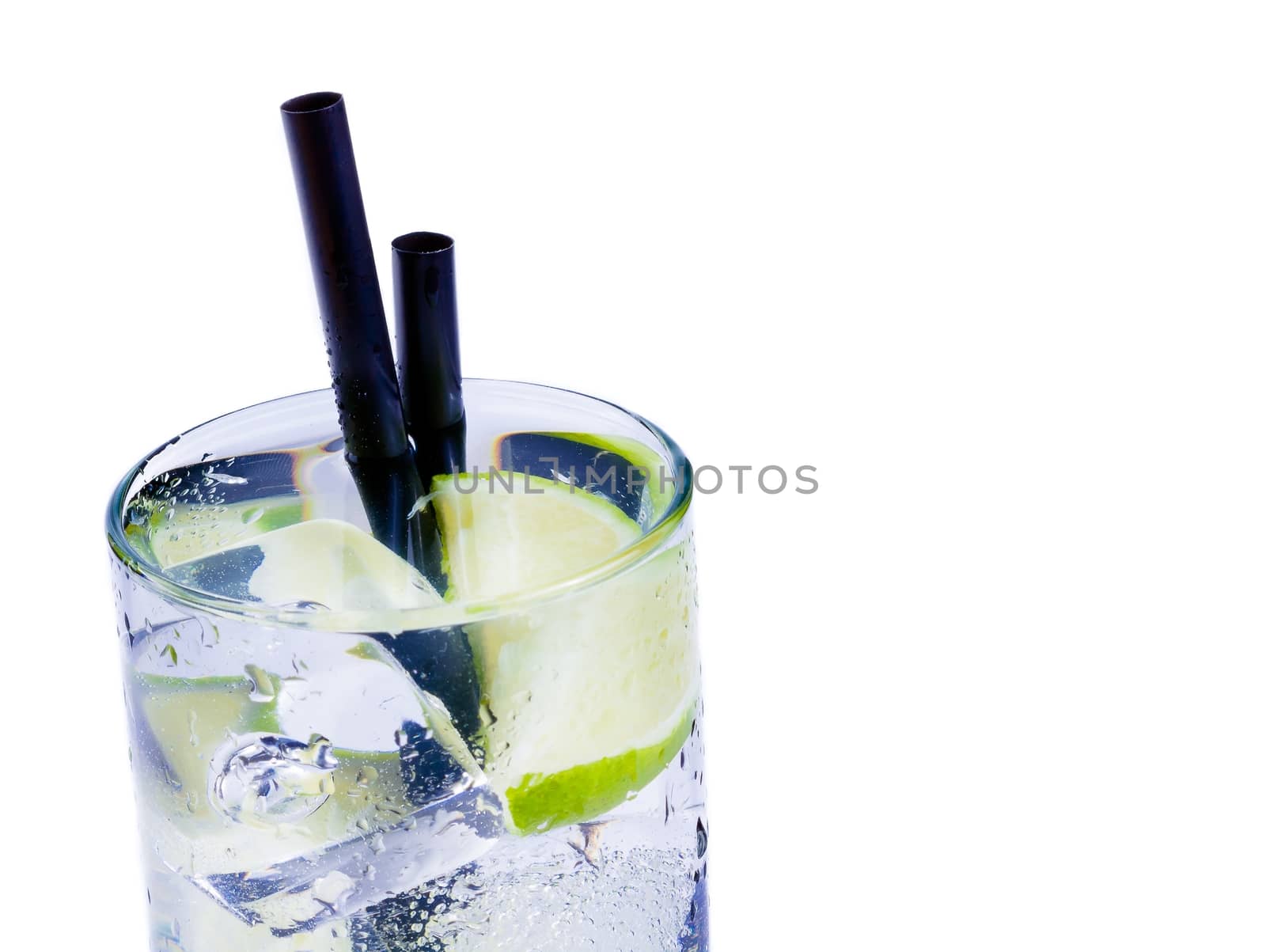 Cocktail with ice and lime slice isolated on white background and space for text