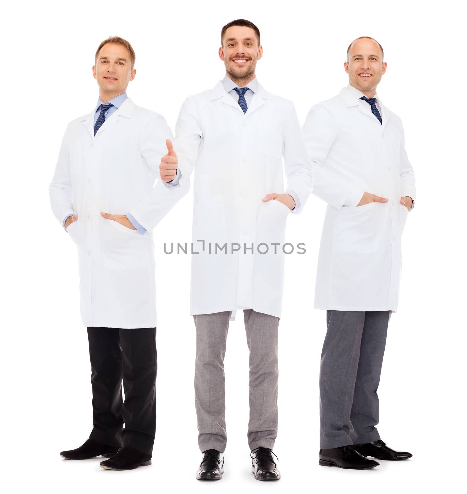 smiling male doctors in white coats by dolgachov