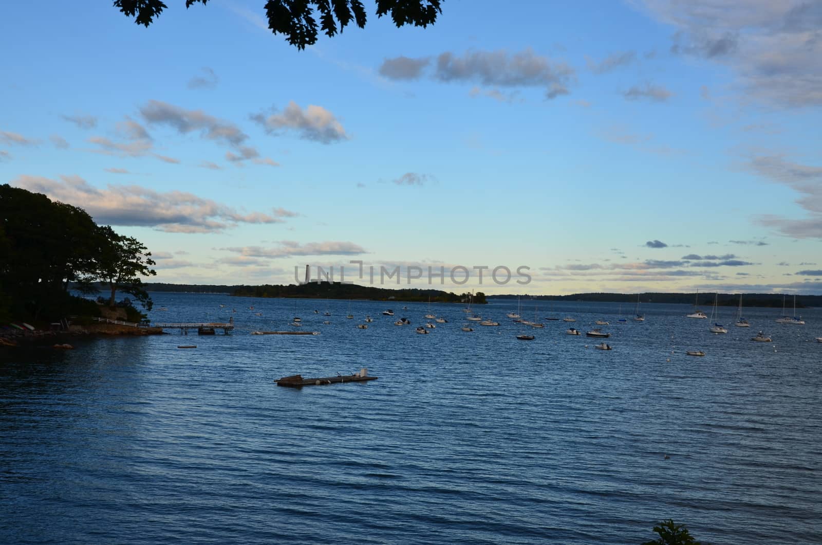 View of Falmouth Maine coastal area with boats moored.