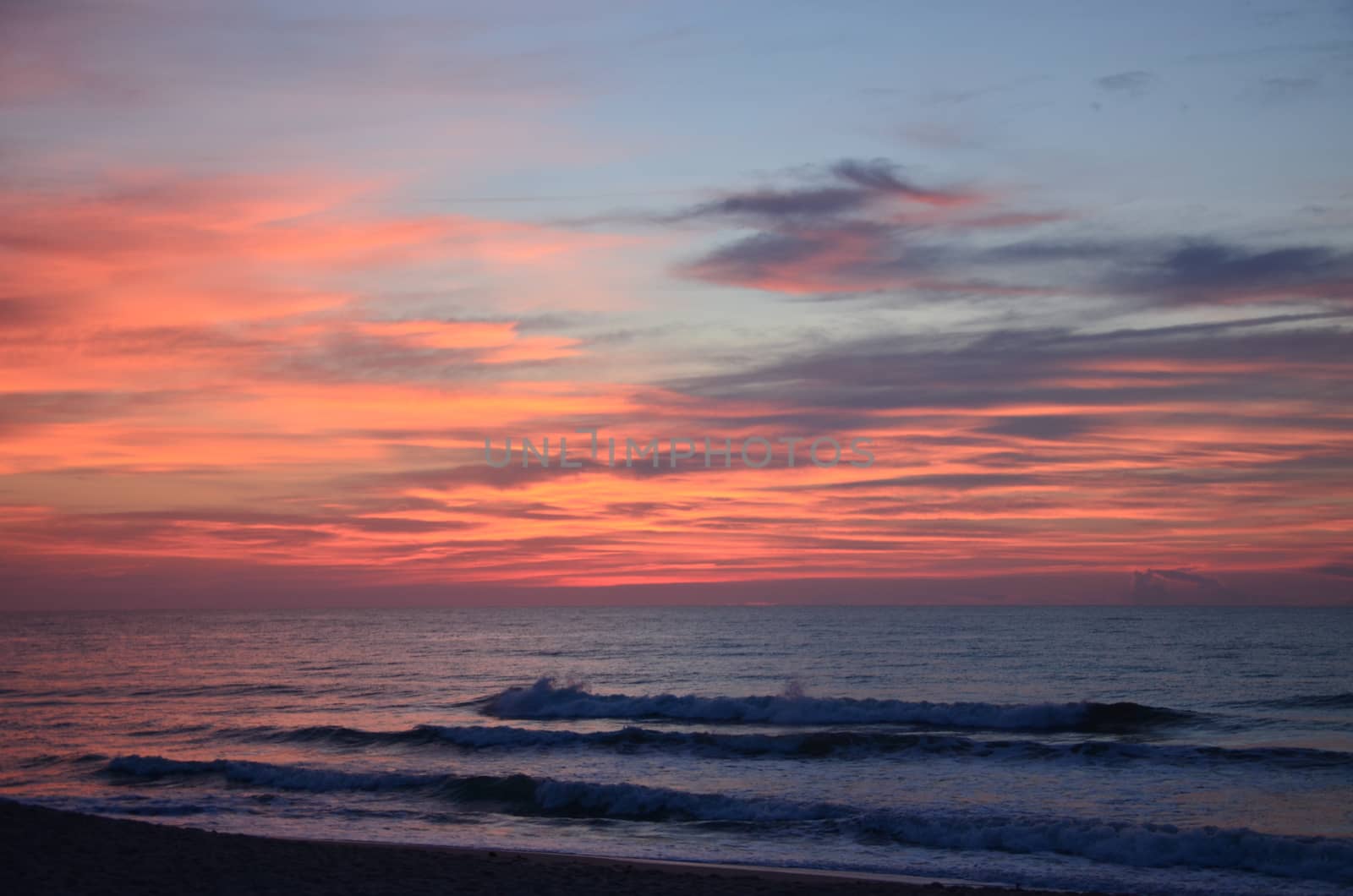 Sunrise at Kure Beach North Carolina on a warm summer morning.