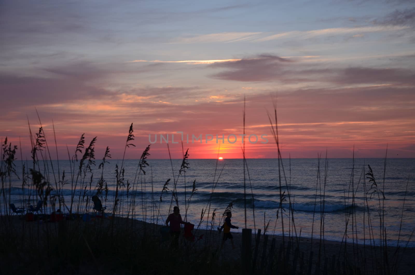 Sunrise at Kure Beach North Carolina on a warm summer morning. The sun coming over the horizon.