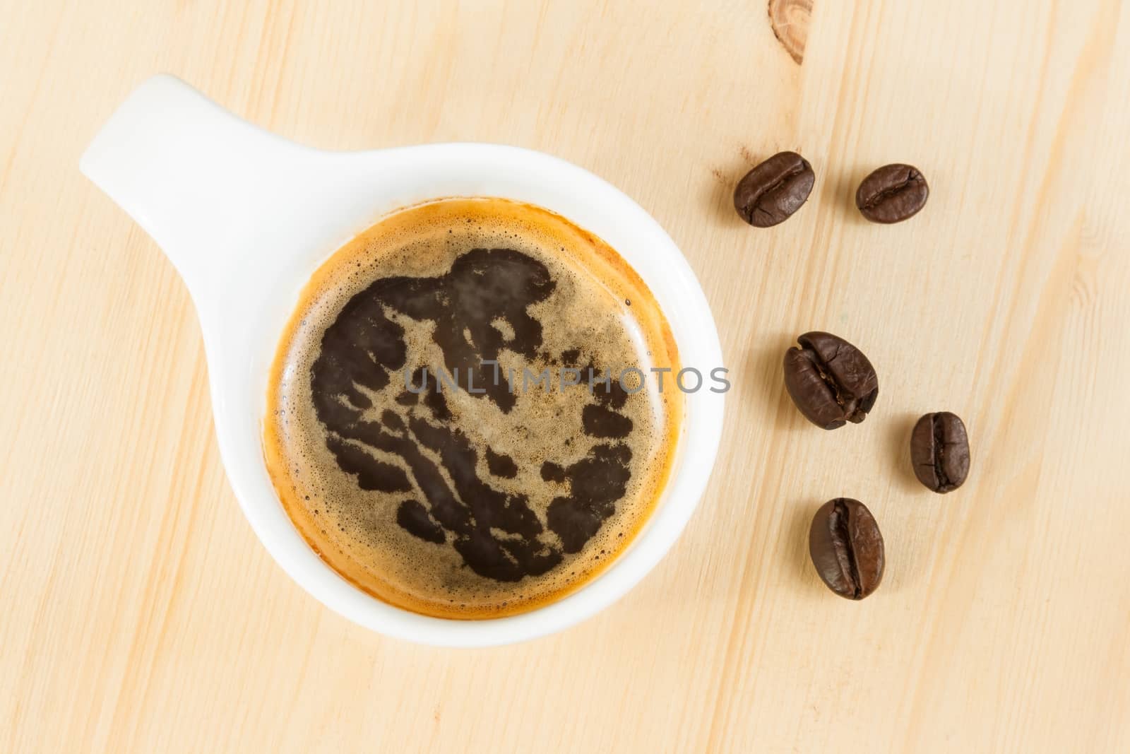 italian espresso coffee cup top view on old wooden near beans,time of coffee break