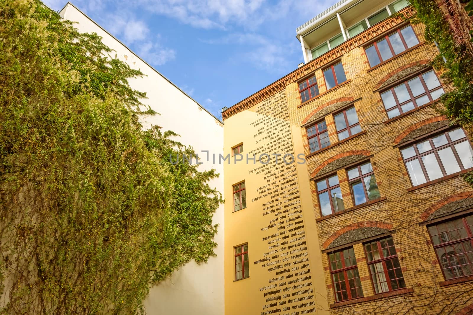 Berlin, Germany - October 26, 2013: Facade of one of the eight yards called "Hackesche Hoefe" in the district Spandauer Vorstadt. They was refurbished in 1993 and host today several shopping malls, galleries and restaurants.