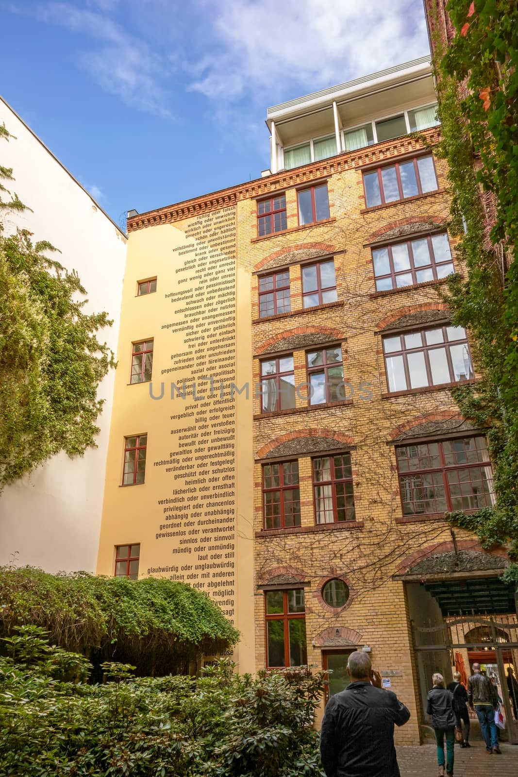 Berlin, Germany - October 26, 2013: Facade of one of the eight yards called "Hackesche Hoefe" in the district Spandauer Vorstadt. They was refurbished in 1993 and host today several shopping malls, galleries and restaurants.