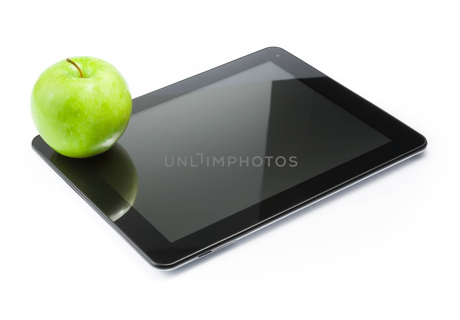 green apple on digital tablet pc on white background by donfiore