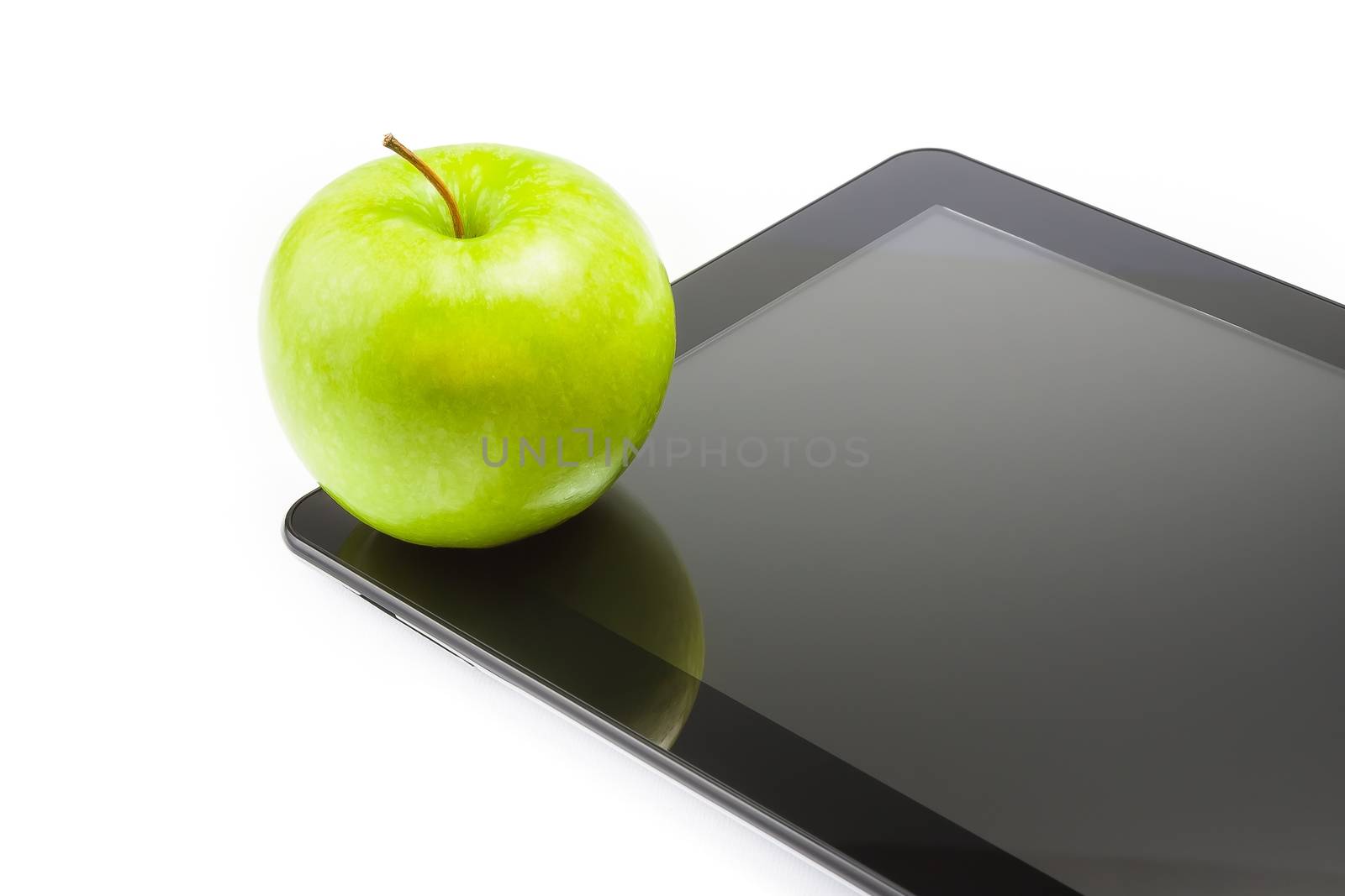 green apple on digital tablet pc on white background with space for text, concept of learn new technology